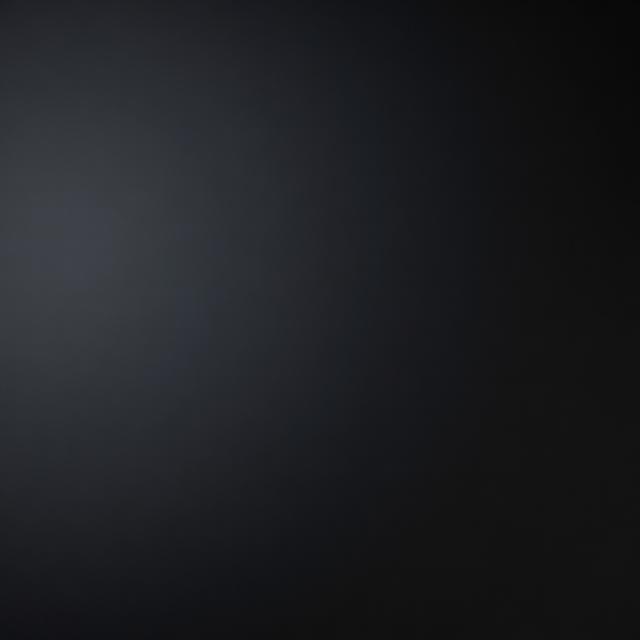 Échantillon de film Noir satiné — Surface noire satinée éclairée en lumière rasante